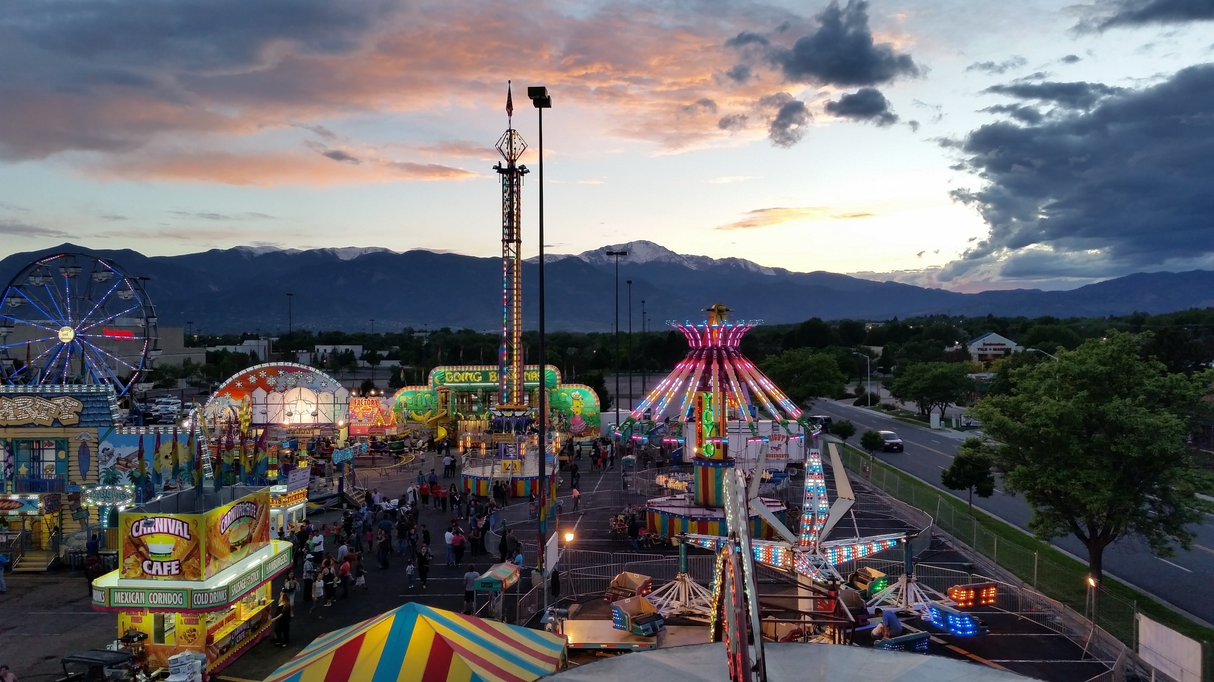 Sometimes you can get lucky and find a carnival at the mall parking lot. We rode the ferris wheel at the perfect time to catch this great sunset. 
#Colorful #Colorado #Carnival