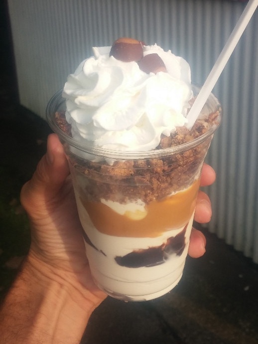 The Buckeye sundae! Vanilla soft serve layered with hot fudge, peanut butter sauce, Reece's peanut butter cups, whipped cream and mini buckeyes! (as an aside, peanut butter sauce may be the single greatest condiment available.)