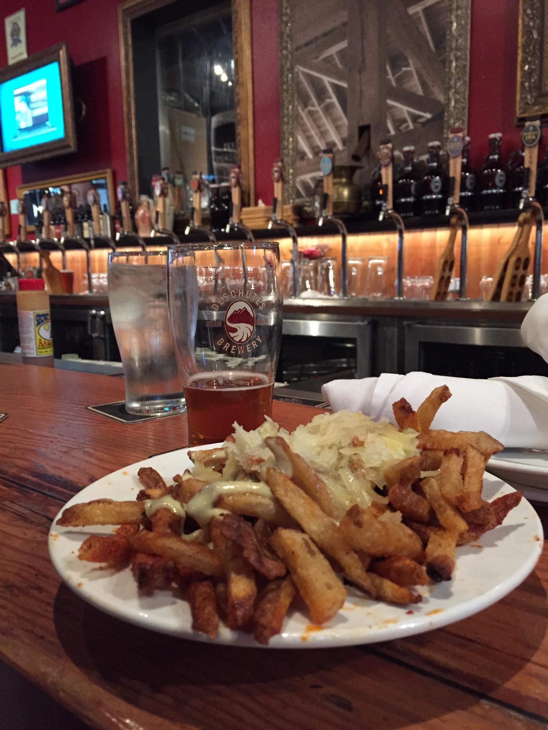 Delicious paprika fries with rosemary oil, manchego cheese and aioli at Deschutes Brewery in Portland, Oregon. Accompanied by a cold River Ale. Yum! #restaurant