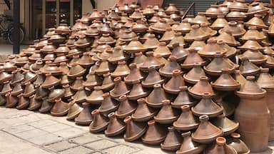 A pottery store displays tajines outside.  One of many stores inside the Medina in the town of Tiznit Morocco. #tiznit #morocco #locallife #tajine #pottery #localpottery #moroccanpottery #cookware #flashpackingbarbie #stoneware