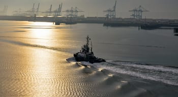 Early morning tug boat in the port area.