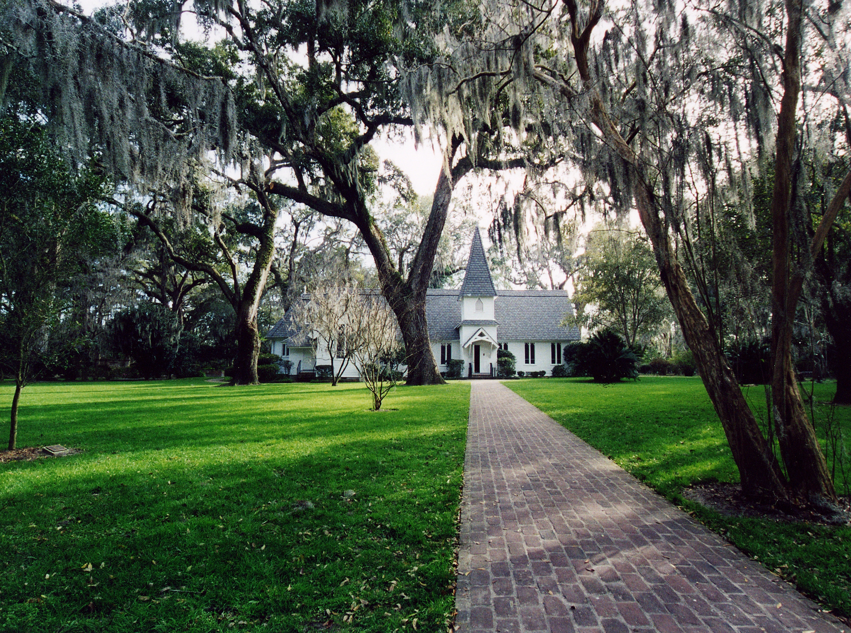 Beautiful church surrounded by Live Oaks.