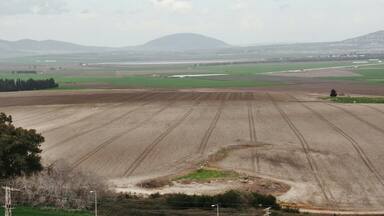 View from top of Megiddo ruins of the Valley of Armageddon with Mt. Tabor I the distance.