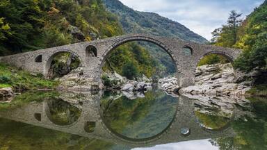 Beautiful old bridge over river Arda in mountains Rodopi close  to city Ardino. Very quiet place