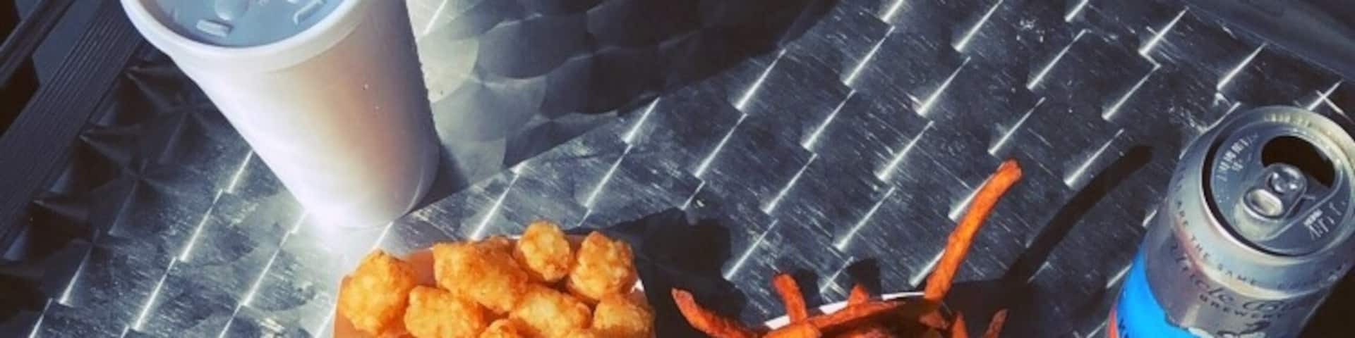 Where else can you sit outside in an enclosed porch and cover up with blankets while enjoying sliders and sweet potato fries? #GoodEats