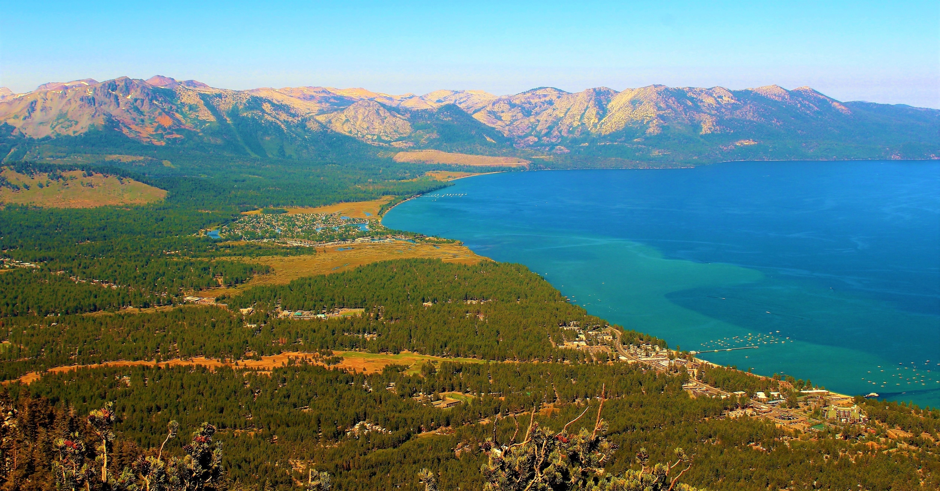 I took this at South Lake Tahoe, California on August 29th. Taken high above the lake, at Heavenly Gondola Vista Point :). This is one of the most iconic views of Lake Tahoe, a lake very popular among Americans. I loved seeing the gorgeous, colorful lake. And the vast landscape surrounding it. The lush, green forest seemed to go on forever. And the mountains were epic! You can even see some snow still atop the mountains. But best of all was the deep, serene lake! I was also at Tahoe for a family wedding. A perfect place for such an occasion! 