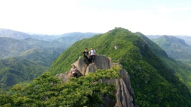 Some friends enjoying their view at the top of the rock. Mount Pamitinan at the back.