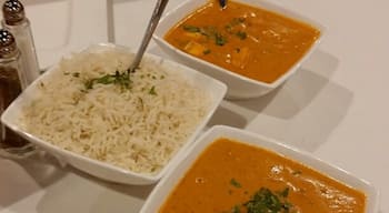 Shrimp Korma in a curry and cream sauce with cashews and raisins, served with basmati rice.