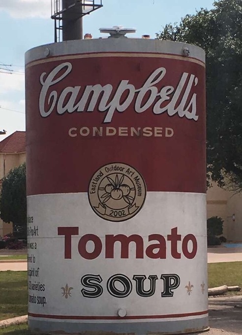 The largest can of Campbell's Tomato soup. The side of the can reads: The Outdoor Art Museum in Eastland features 18 interpretations of famous art, including the soup can painted into a cylinder (transforming Warhol's pop art commentary of consumerism into a big product placement). The replica masterpieces are scattered around town and local businesses.
#popart #outdoorart#roadtrip
