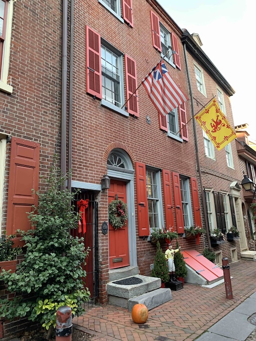 View of Elfreth's Alley with preserved colonial homes and cobblestone streets in Philadelphia.
