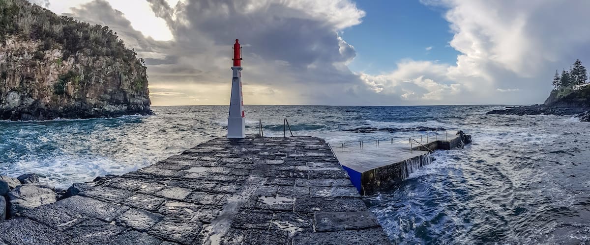 From the port of Caloura between heavy showers and sunshine. Not the day to take a swim.