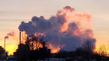 The sun rising behind the steam from the local paper mill resulted in some beautiful colors this cold winter morning.