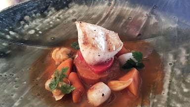 Just a sample of the elegant and tasty courses Chef Routt will offer.  Here we have black cod, Manilla clams, Bay scallops, saffron, summer tomatoes, and a baguette.