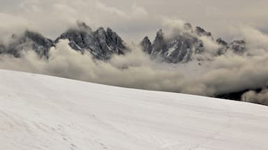 I took this in the legendary Dolomites! In Northern Italy, near Brixen/Bressanone. And this was from my last day in the Dolomites. And as far as beauty it was my favorite day! I loved seeing the fog in the mountains and valleys! And the beautiful winter forests :). This was one of my favorite viewpoints up there. I loved how low the fog was hanging! Yet also giving good views of the mountains. It was truly breathtaking to see. And this was only one of many spots around there. A great memory from December 2017!