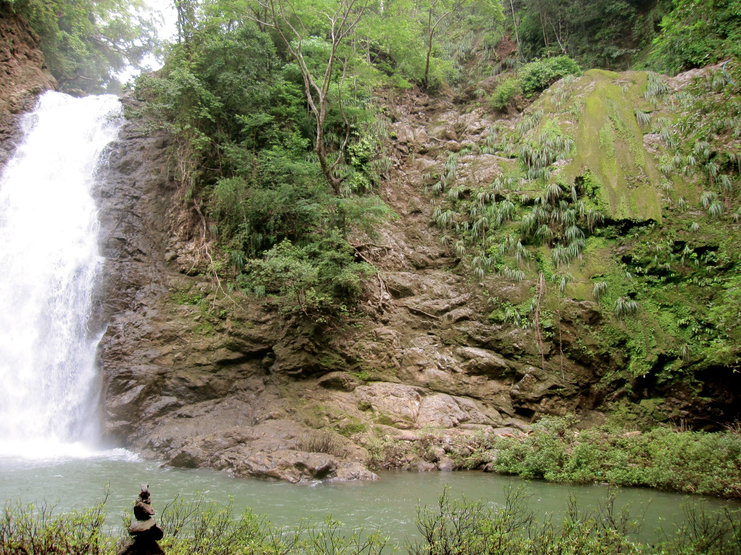 These are the Montezuma waterfalls-- and there are two more above this big one that you can jump off! 
Only a 20-30 minute hike up to the top. Be sure let a local show you the longer way around to hike to the 2nd and 3rd falls rather than climb up waterfall itself.
To find them you just go behind the Mariposario bed and breakfast.