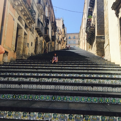 Beautiful little town! Delicious food to be had in garden restaurant to the left of the steps. Buy your Sicilian ceramic treasures right here in this neighborhood and stop for delicious granita on the way up the steps 😎