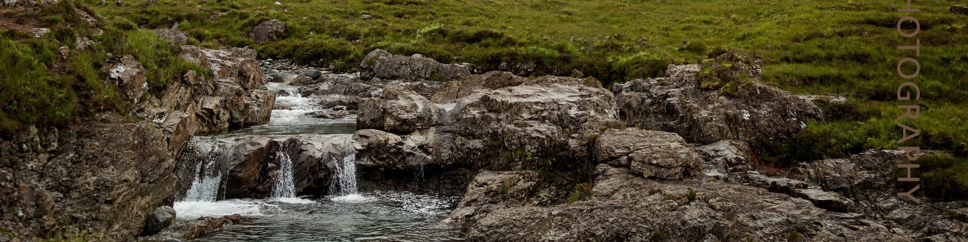 The Fairy Pools near Glenbrittle at the foot of the Black Cuillin Mountains on the Isle of Skye in the Highlands of Scotland. Very busy attraction but oh so beautiful to see.....walk along the path beside the falls and meandering river and enjoy this stunning location. Free admission is a bonus but watch the slippery rocks and steep climb back to the car, it's a bit of a killer!  Perhaps partake in a coffee from Cuillin Coffee Van in the carpark when you're done.