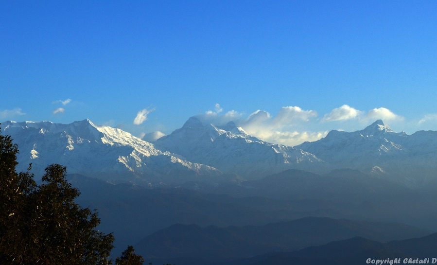 I was melting in nature's arm, with first glimpse of Sunrise."Zero point" is called the 'Sunrise Point'. It's a 2 kms trekking, but looks like 20 kms......haha; when one has to start at 4:30 am in chilling weather of march, with almost 3 layers of clothing(imagine how I managed to walk in that...haha). Zero point gives you the 360 degree view of the Himalayan range ie. Kedarnath Peak, Shivling, Trisul and Nanda Devi. What a beautiful sunrise!! As the golden sun 'Rise and Shine', the Himalayan Peaks shimmer and dances on his commands. So perfect, so eyeful, so scenic.#mountains
#snowcappedmountains#binsar#india#travelbazzinga#trover