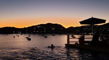 Serene Sunset
The golden glow of the setting sun highlights the many sail boats in Zihuatanejo Bay.  Thus week is Zihua Sailfest, where the boats come once a year and offer sail and music cruises for donations to local schools.  Last night was the Sail Parade to Ixtapa and back, this week Music and Sunset cruises.
All proceeds go to the schools and they hope to beat last years $7,000 donation.