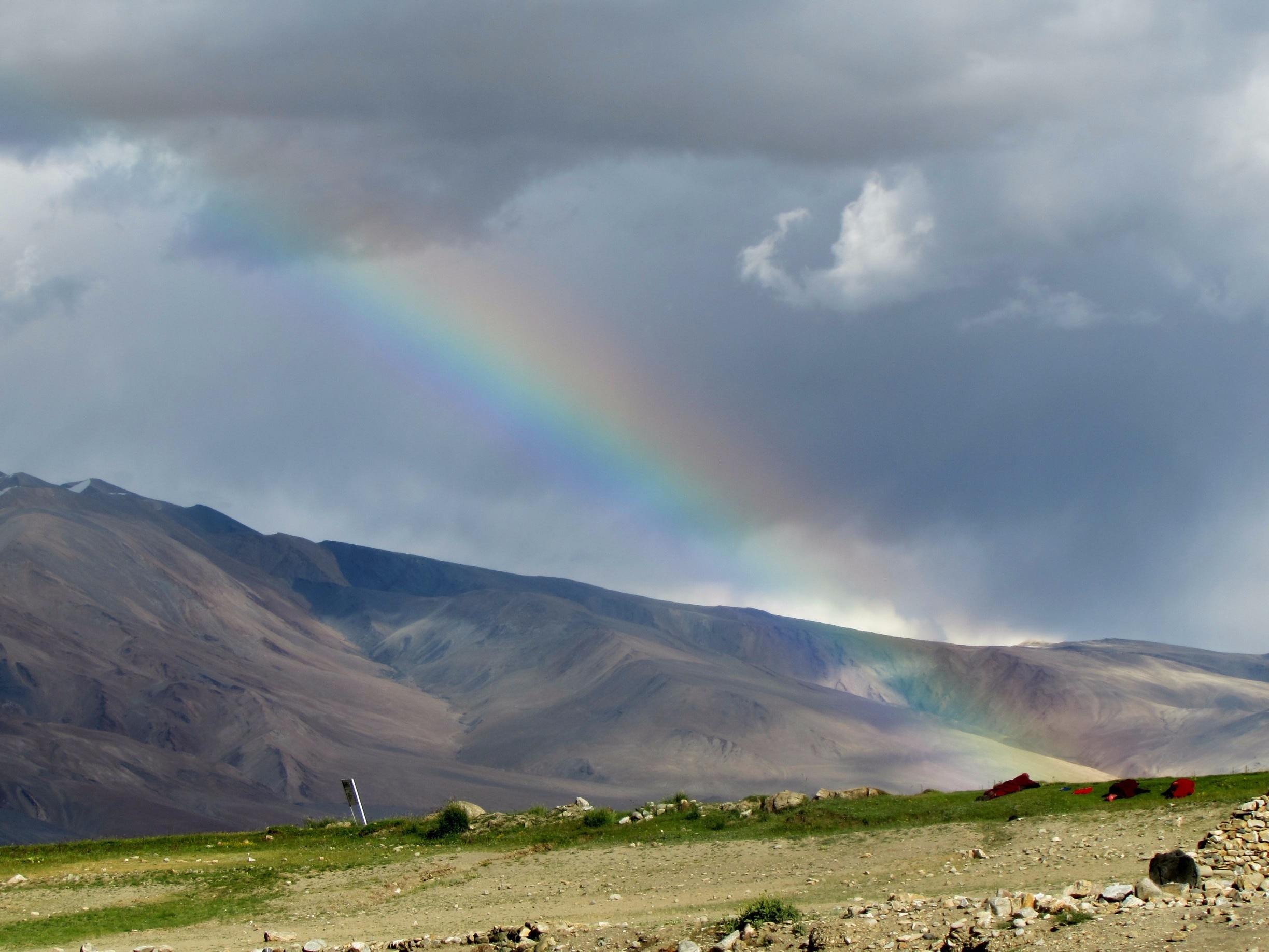 Monks having a rest at the end of the rainbow during the monastery festival.

Most inhabited by Chang-Pa nomads, at 4560 m, Korzok is probably the highest permanent settlement in India. Tso Moriri Lake, the backdrop of this village, is revered and considered sacred by the local people.