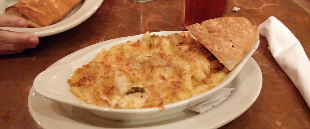 Creole Mac & Cheese: Andouille sausage, roasted chicken, caramelized onions, red and green bell peppers and mozzarella, topped with panko bread crumbs
