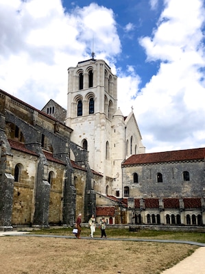 Vézelay Abbey or Abbaye Sainte-Marie-Madeleine de Vézelay is a Benedictine and Cluniac monastery in Vézelay in the Yonne department in northern Burgundy, France. The Benedictine abbey church, now the Basilica of Sainte-Marie-Madeleine, with its complicated program of imagery in sculpted capitals and portals, is one of the outstanding masterpieces of Burgundian Romanesque art and architecture. Sacked by the Huguenots in 1569, the building suffered neglect in the 17th and the 18th centuries and some further damage during the period of the French Revolution.
The church and hill at Vézelay were added to the UNESCO list of World Heritage Sites in 1979.