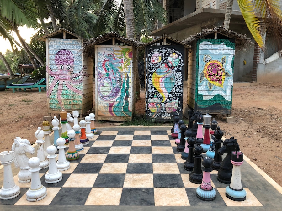 Some funky changing sheds and giant chess to amuse you while you wait for your order at Papa Mangoes.