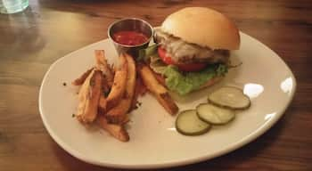 The self proclaimed "DAMN GOOD BURGER" - Dry aged beef, house baked buttery roll, cheddar, sautéed onion, lettuce, tomato, English pub sauce & fries.