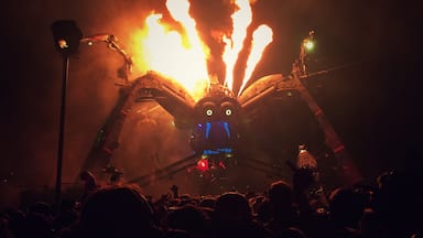 Giant, mechanical spider... spitting out fire and lasers! Run for the hills. 

#festival #music #art #fire #laser #dance