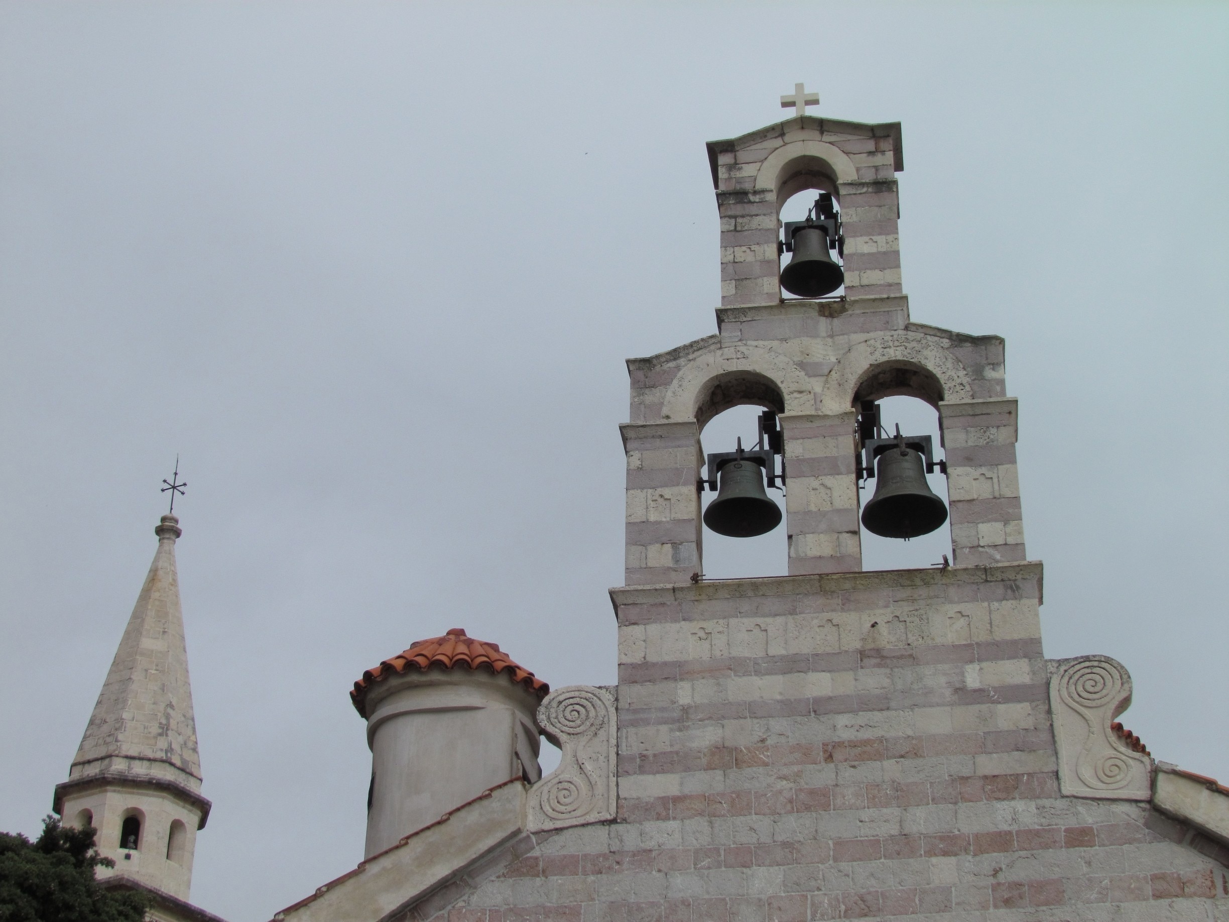 Budva is a beautiful town on the Adriatic sea.  The old town is great to wander around in.  This photo represents three religions existing in harmony; Muslim, Orthodox and Christian.