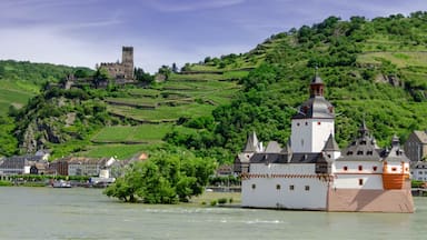Pfalzgrafenstein Castle in the foreground is a toll castle that was erected in 1326-1327.  It sits on Falkenau Island on the Rhine.  Burg Gutenfels in Kaub can be seen in the distance.