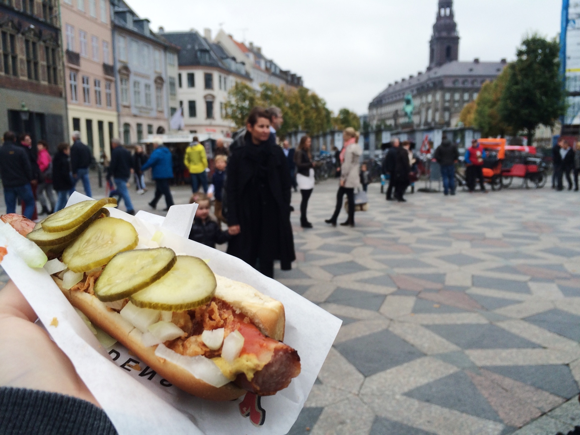 Amagertorv square in Copenhagen is a great place to people watch while you eat a delicious hot dog while sitting on the edge of the fountain. 