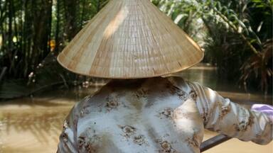 One of the highlights of our trip to the Mekong Delta in Vietnam was a trip on a small hand-rowed boat between My Tho and Ben Tre. We were on a tiny boat operated by two lovely Vietnamese ladies who skillfully rowed the boat through a small creek in a jungle of coconut trees. #AquaTrove #Vietnam 