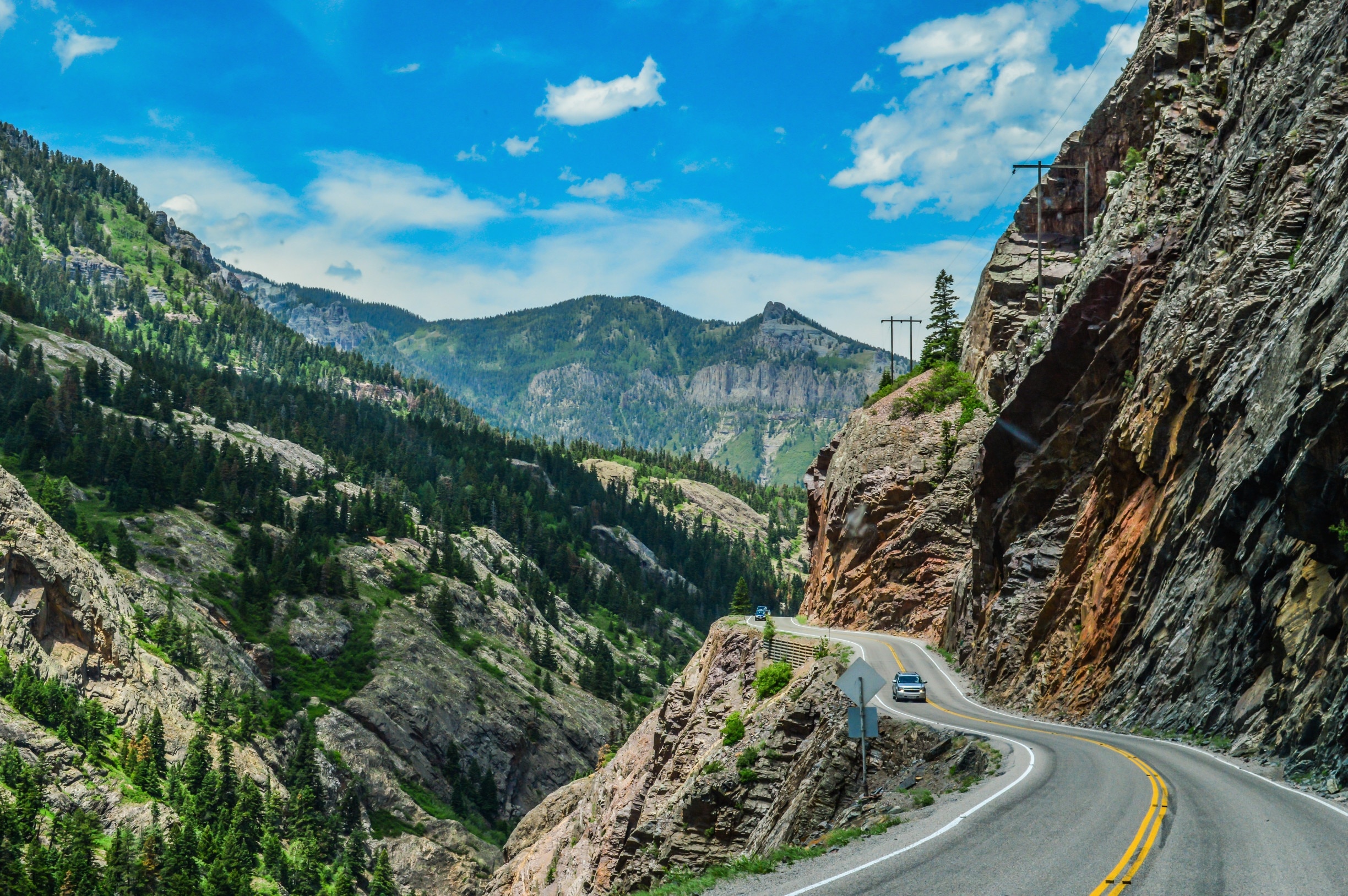 A section of US Route 550 that runs from Silverton to Ouray in Colorado is knows as "The Million Dollar Highway", and it's a thrilling (or terrifying) ride. Narrow roads, steep cliff walls, dizzying drop-offs....and no guard rails. It all makes for a white-knucke drive, albeit one with breath-taking views. There's some conjecture about the origin of the name - some say it's because it cost a million dollars to create, others say it's because of the million dollar views. Either way, it's a drive you won't soon forget. #colorado #ouray #milliondollarhighway #silverton #roadtrip #beautifuldrives