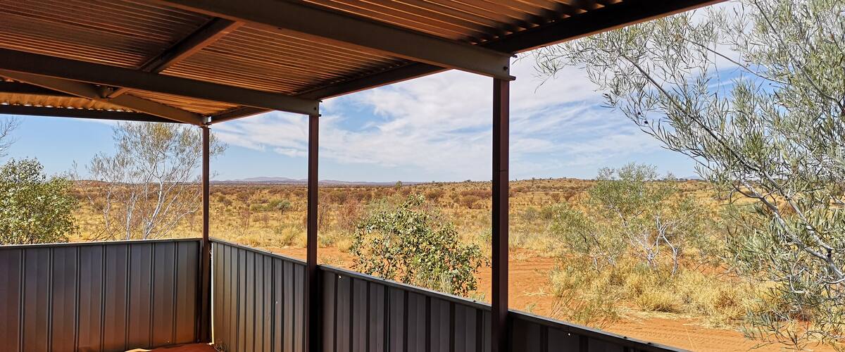 We went here with SEIT Tours based out of Yulara.  Set on private property held by local indigenous people, it is only accessible with 4WD and special permission, most easily obtained through an organised tour.  We left Yulara Resort at 0730 and returned at 1730, with about 4.5 hours actually at the site.  This is a sacred site and is part of the Seven Sisters Songline.  As such, I have no photos from the path to the cave or inside the cave, but there is some beautiful rock art here.  We were led by Lee on site, a local elder.  I highly recommend this tour - the guides were great and the scenery makes all the driving worthwhile.  This was taken from the onsite shed where morning tea, lunch and much conversation was had.