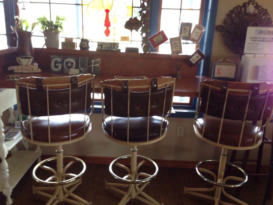 Quaint cafe with cute art and furniture in a small town overlooking main street