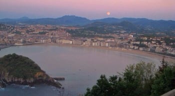 San Sebastián at sunset. Short hike or gondola ride to the top of the viewpoint. There's an awesome old school amusement park at the top of the mountain