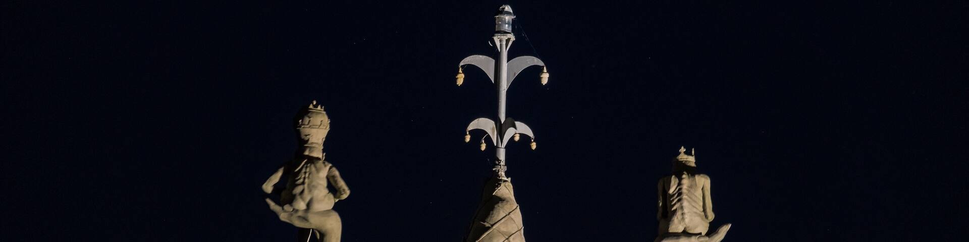 Imperia is a statue by Peter Lenk in the harbour of Konstanz. She is 9m high, weights 18 tons and turns on its axis every 4 minutes. 
Her location in the harbour makes it possible to integrate her into compositions of lunar eclipses ( such as the one of July 27 2018 in this case). 
Very popular spot #LikeALocal