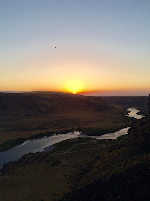 Overlooking the snake River at sunset. Recent Forest fires has put a lot of smoke in the sky and give the unique sunset. 