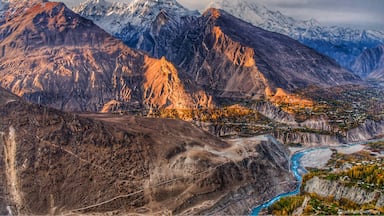 One of the best autumn one can experience anywhere in the world and it is in Hunza. The image captures one the highest peak in the region, Rakaposhi (7788m - ranked 27th in the world) covered with clouds at the sunrise time. The image is taken from a point called Eagles Nest and it is unique in a sense that almost 11 or so peaks above 6000m can be seen from this spot. #Rakaposhi #EaglesNestHunza #TravelPhotography #Hunza #Autumn