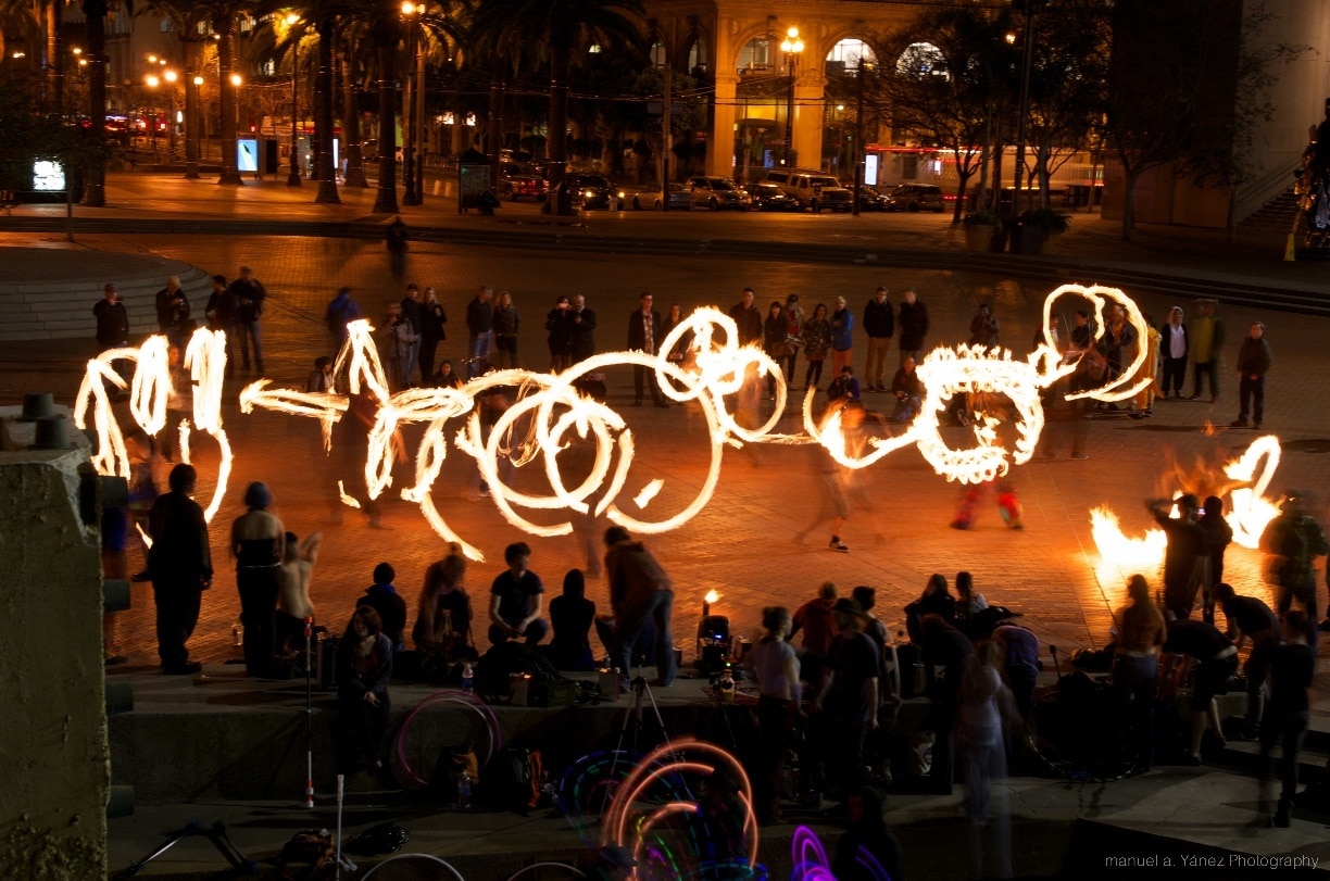 I discovered that on the 2nd Thursday of each month, a group of Fire dancers get together and perform.  It is a great, great photo op.

The location changes around the City.  But if you Google it, you can find some info.

http://www.flickr.com/photos/demanuelalberto/sets/72157640986058615/
