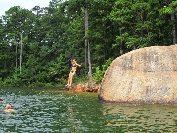 Rock jumping. Beautiful Lake in southern GA