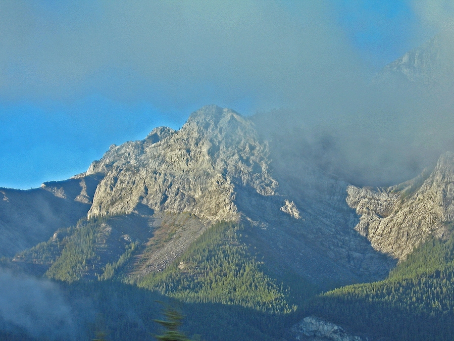 First early morning view of The Canadian Rockies from The Rocky Mountaineer between Calgary and Banff