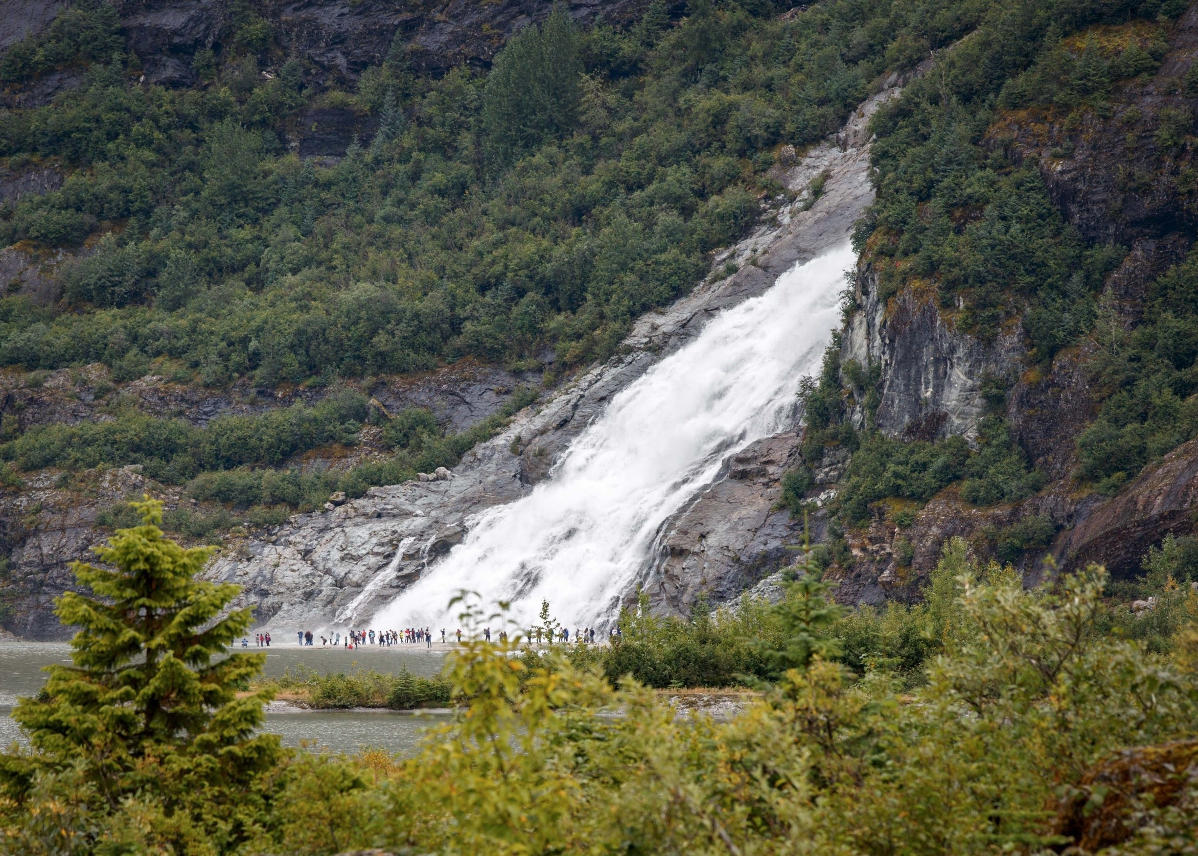 If you're in Juneau Alaska, I'm sure you will visit Mendenhall Glacier National Park. This is a pic of Nuggett Falls from a distance with all the visitors in the front to give a perspective of the power and size of the Falls. Be prepared for crowds if you're there in the summer.  
