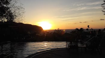 Pelican Eyes Resort in San Juan del Sur, Nicaragua.  Amazing infinity pool with a bar.  The perfect place to watch a sunset in SJDS.  #sunsets #surfsudsandsights #travel #Nicaragua 