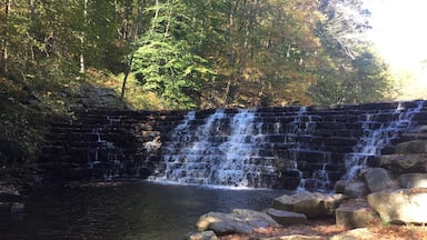 This is Jones Mill Run Dam, located in Laurel Hill State Park in western Pennsylvania. It's a relatively short hike to get to this spot, but it's worth it to explore more of Laurel Hill's trails. There's something different to see in every season, but make sure you stop by the park office to pick up a trail map. #hiking #Pennsylvania