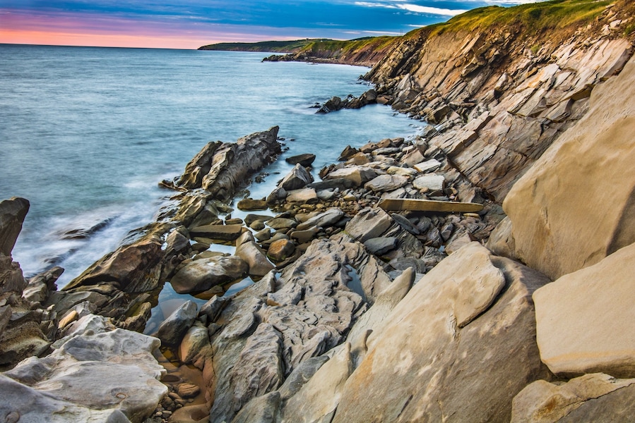 Rock formation lit by the sunset on our way to Cape Breton National Park. Make sure you have a good pair of shoes because you will need to go down a slope to get close to sea level. After that tons of cool photo to be discover. #BVStrove