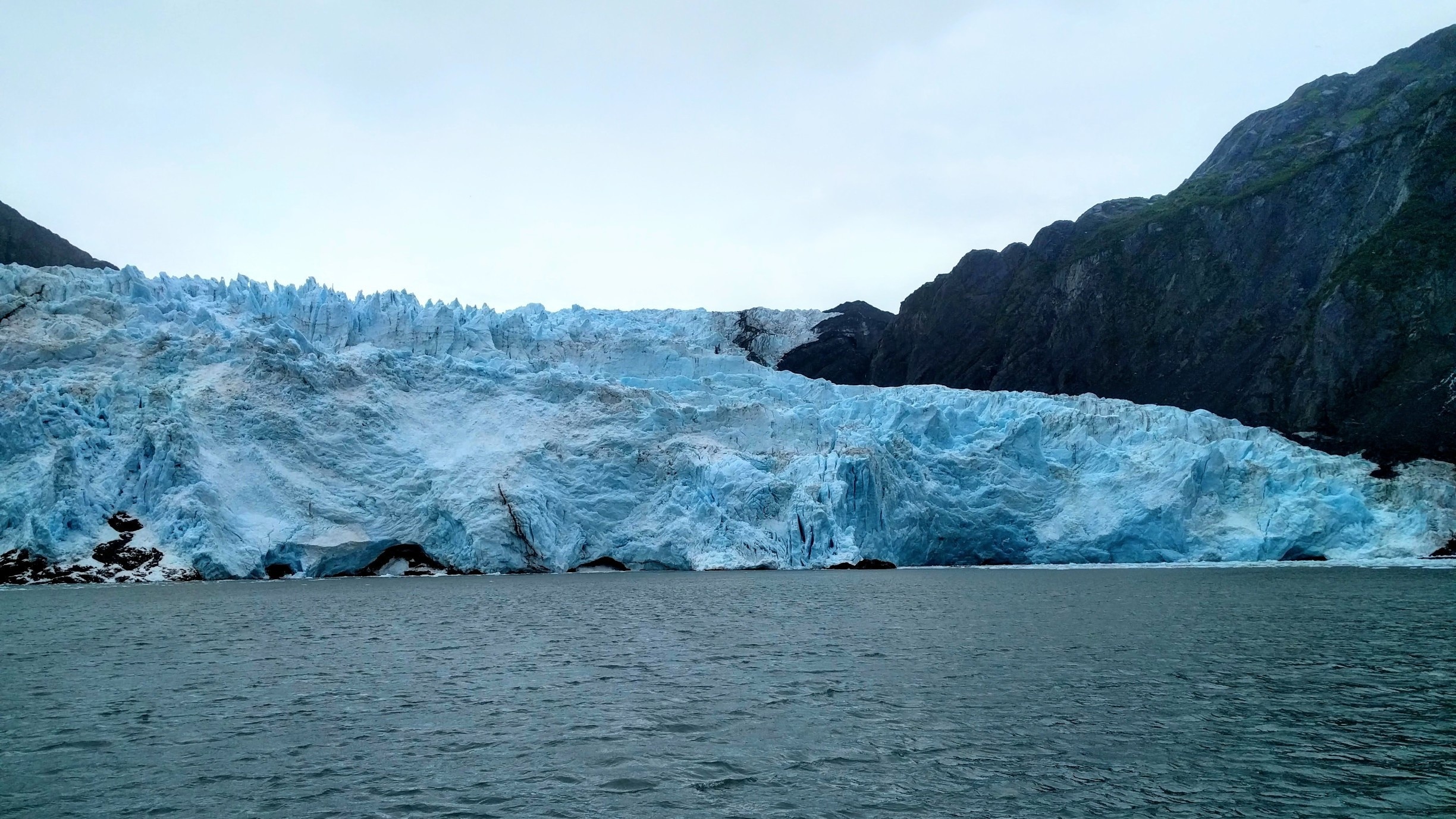 A majestic, 500 foot tall, mountain of a glacier spotted from the Kenai Fjords tour cruise.