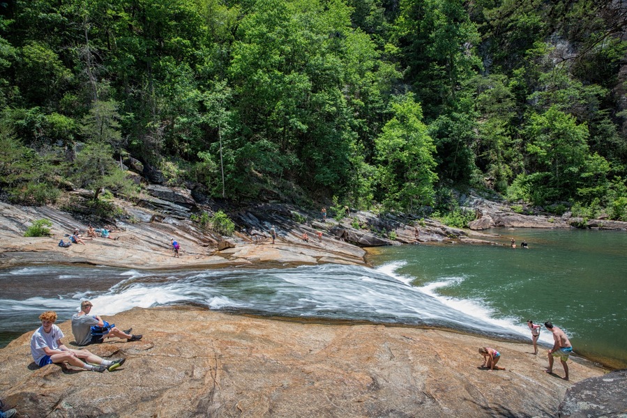 This is Bridal Veil Falls on the Tallulah River at the bottom of Tallulah Gorge on a hot June day. Even though it's a steep climb down into the gorge, many young kids and teenagers love to come here to slide down Bridal Veil Falls into the pool below. The problem - the quarter mile climb out is extremely steep and more like a rock climb than a hike.