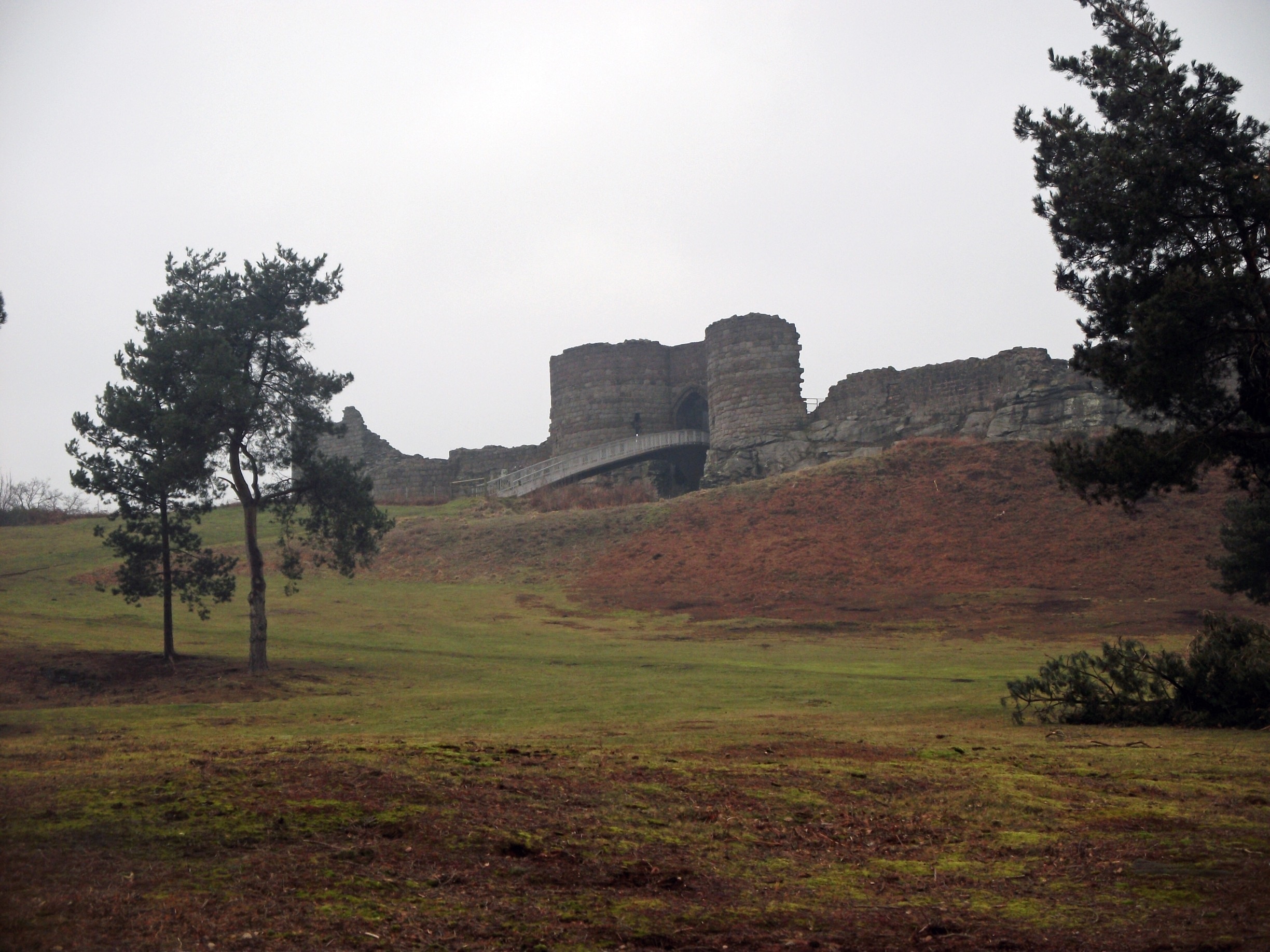 Autumnal colours and a misty grey sky lend a little atmosphere to Beeston Castle ruins in the background...